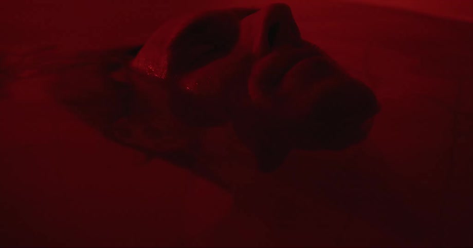 A man is floating in the bathtub