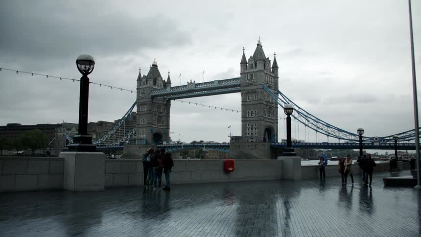 People walking on a wet walkway