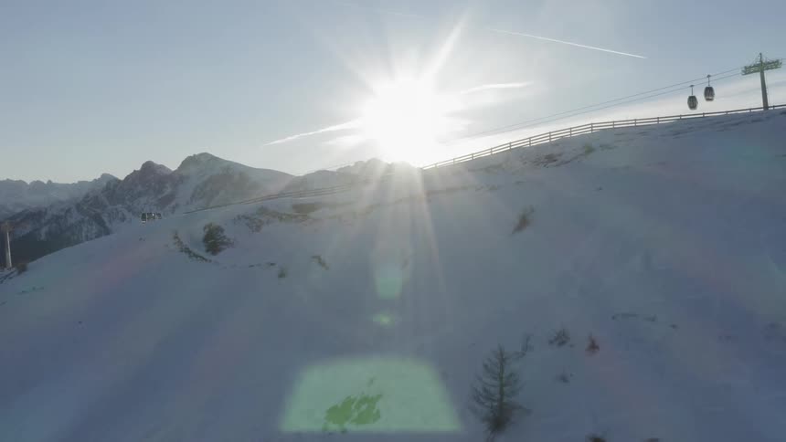The ski lifts mover over the slope