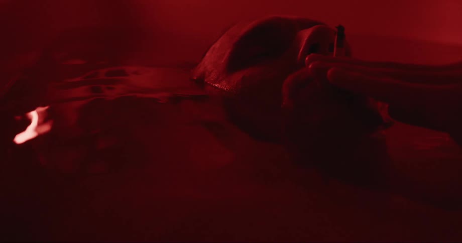 A man is smoking in the bathtub