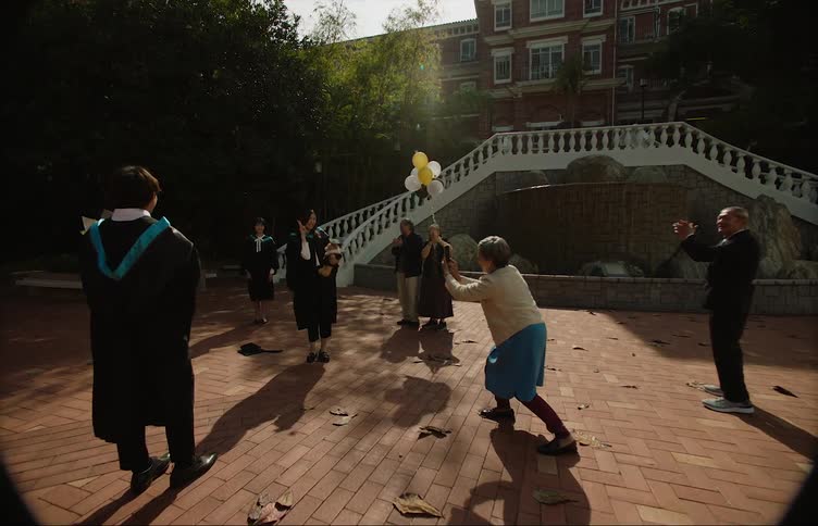 Students celebrate graduation outside the school