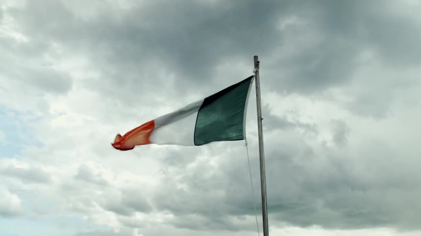 Red, white, and green flag blowing in the wind