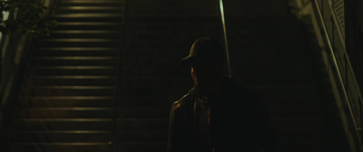 A man climbs down the staircase