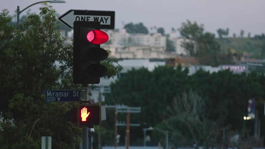 A traffic light in a neighborhood changes from yellow to red