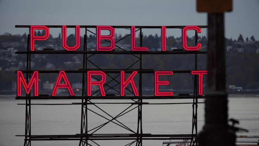 A lit sign has red letters