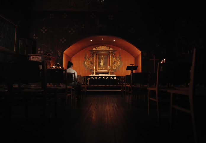 A woman is sitting in the church