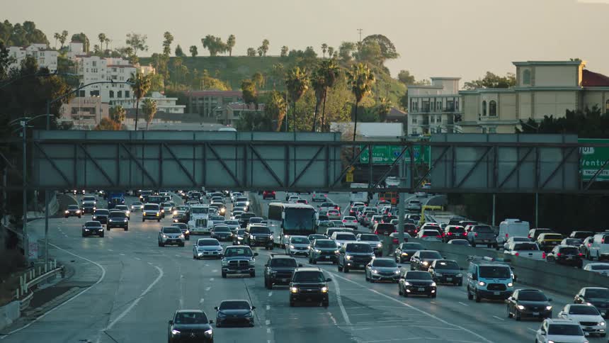 Cars driving on a freeway in a city