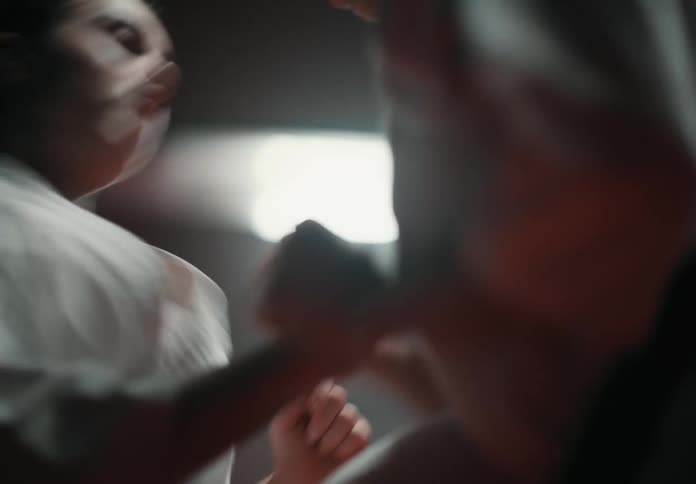 Two people are sparring together