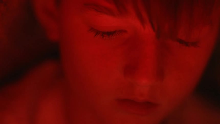 The lights flash on the childs face