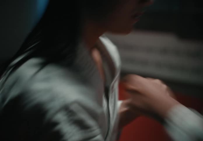 Two women are boxing each other in a gym