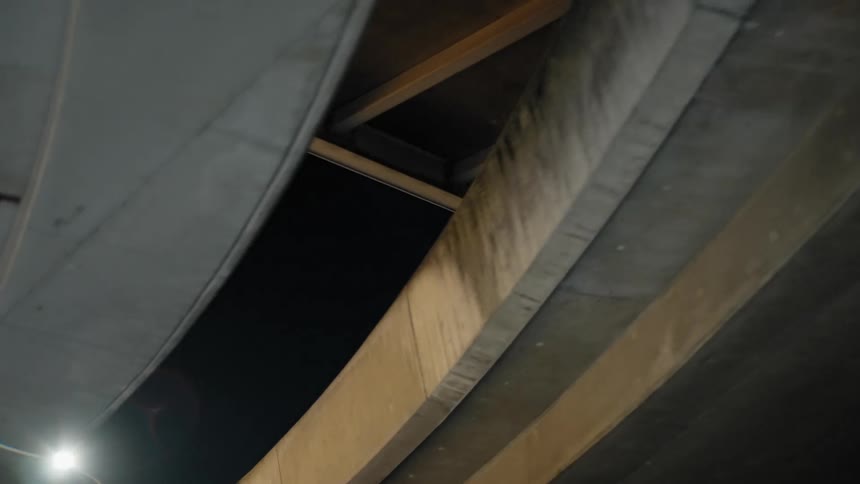 Thick oval columns hold up a bridge downtown