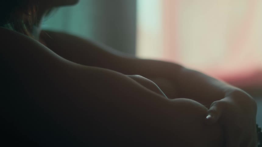 A woman is sitting on the floor