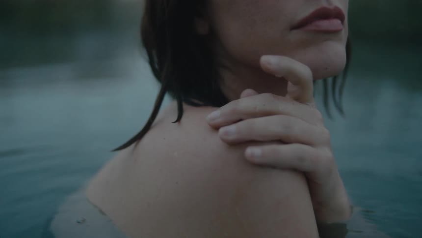 A woman is bathing in the water