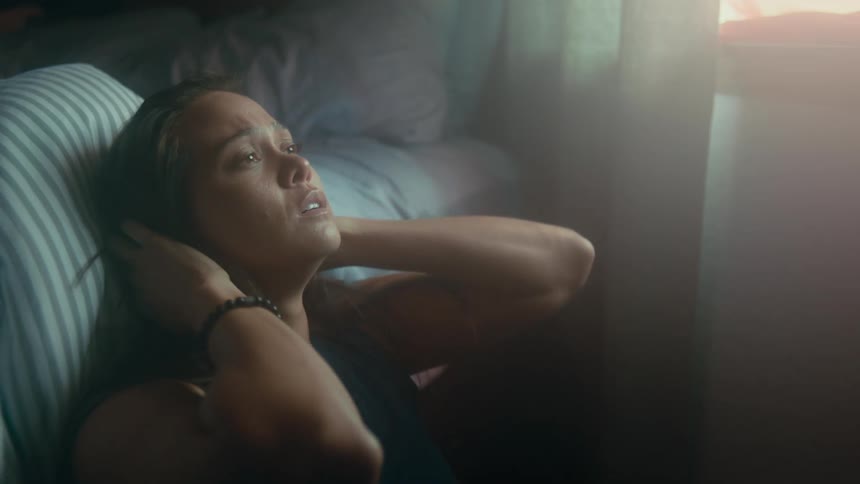 A view of a woman sitting in a room