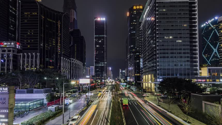 Heavy traffic in downtown city at night
