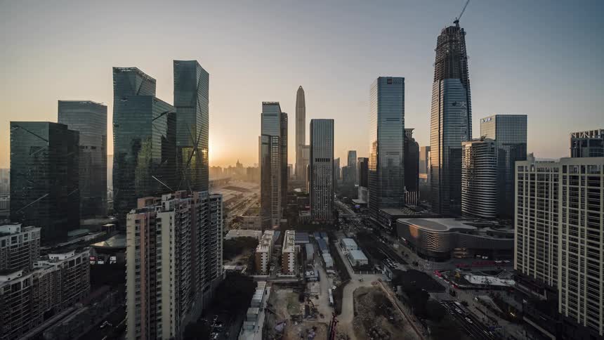 City skyline with high rise buildings and vehicles driving on highways