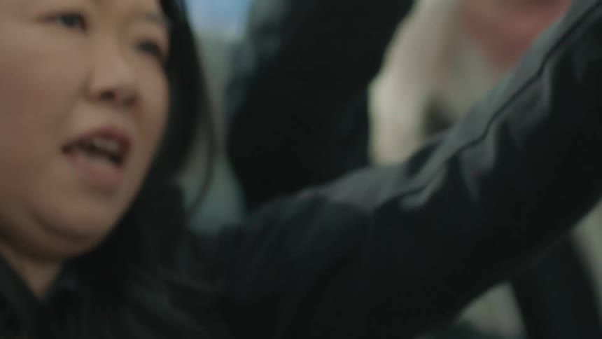 A woman shouting outdoors