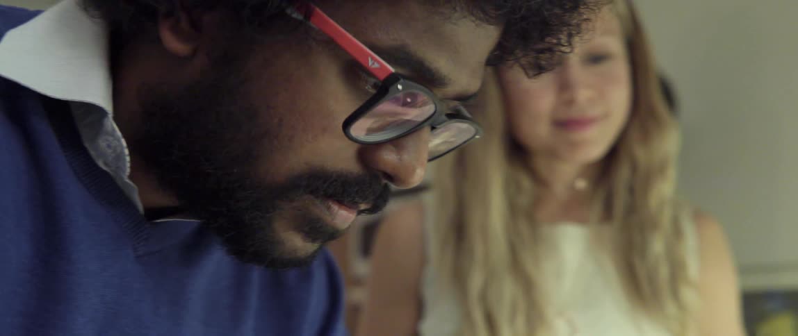 Man and Woman Looking at Something Together With Curious Expressions in a Quiet Shared Moment