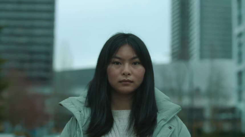 A portrait of an asian woman outdoors