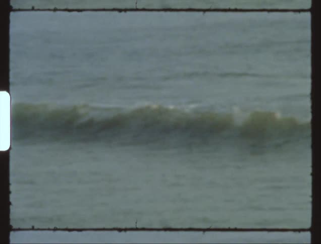 Footage of ocean waves moving towards the beach is displayed