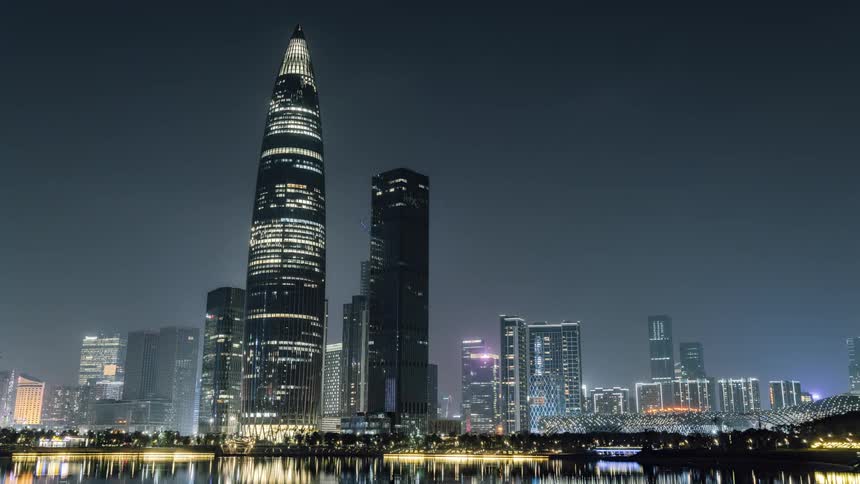 Aerial view of a downtown city at night is displayed