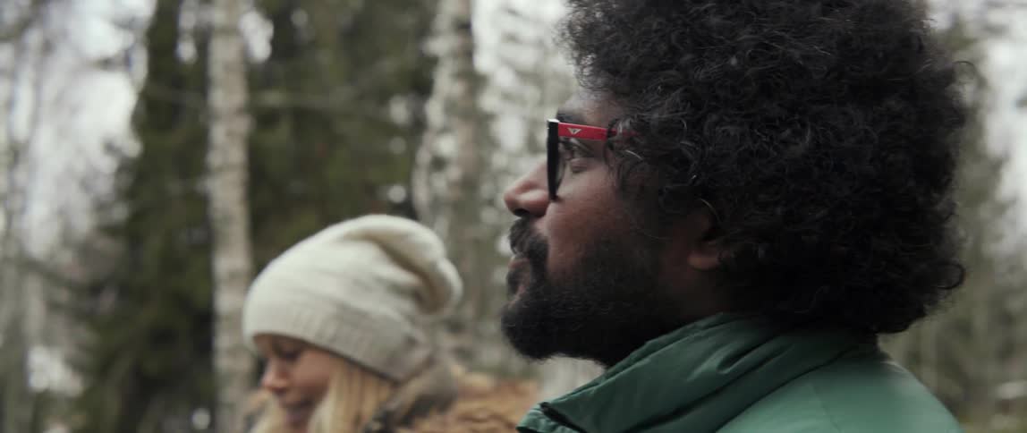 Man and woman outside on cold day with cozy winter conversation vibe
