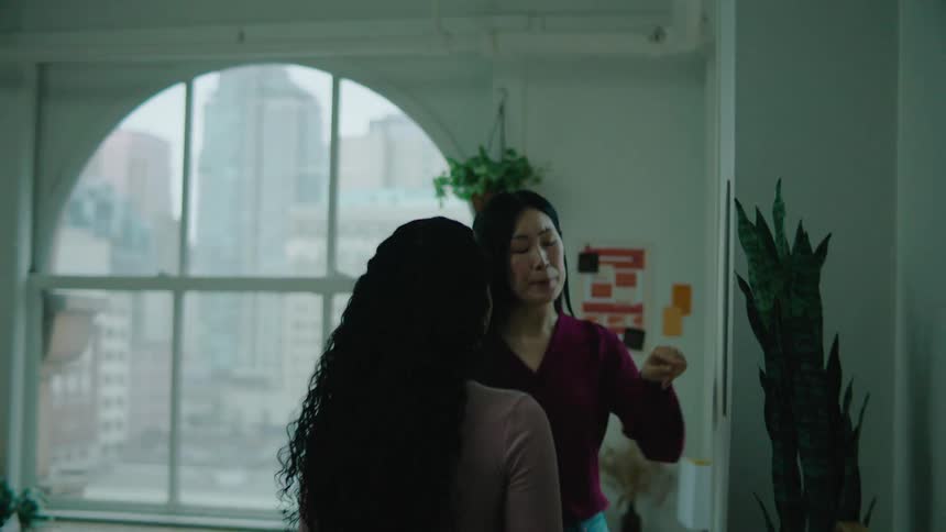 Two women talk in the office