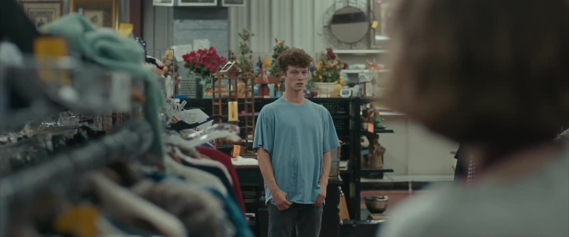 Distressed teenager walking out of a store