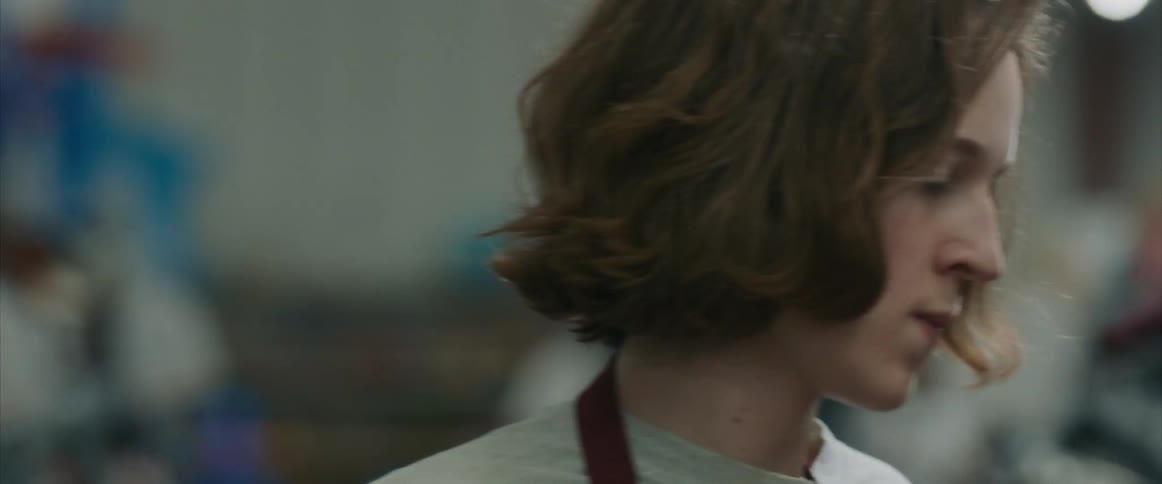The boy turns to look at something frustrated