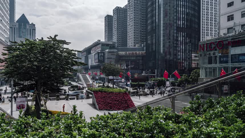 Pedestrians travel through the city