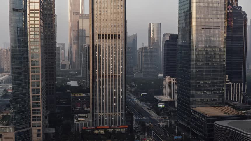 A city wakes up and starts moving as the sun rises