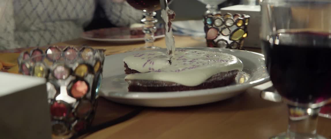 Iced dessert being sliced and served with fresh elegant culinary detail.