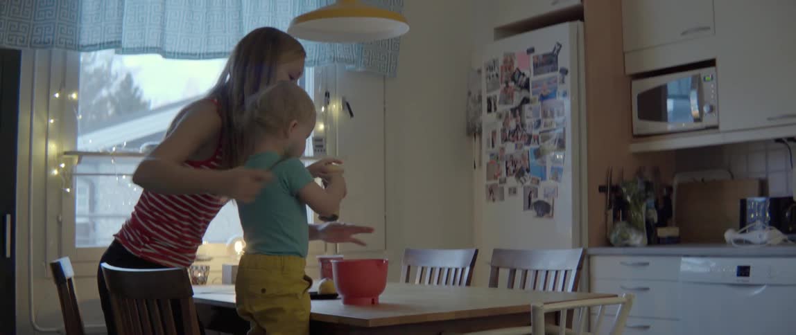Heartwarming domestic scene of a mother and child preparing a healthy recipe together indoors.
