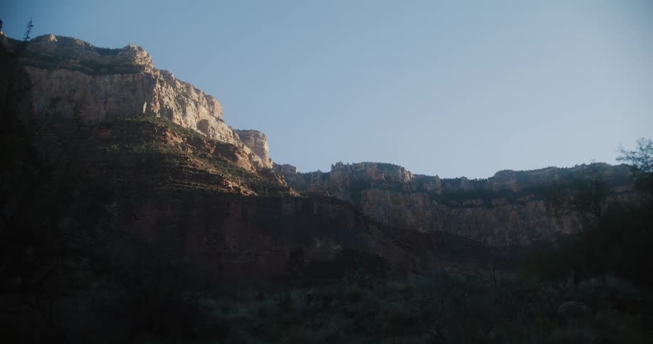 Aerial view of a cliff is displayed at midday