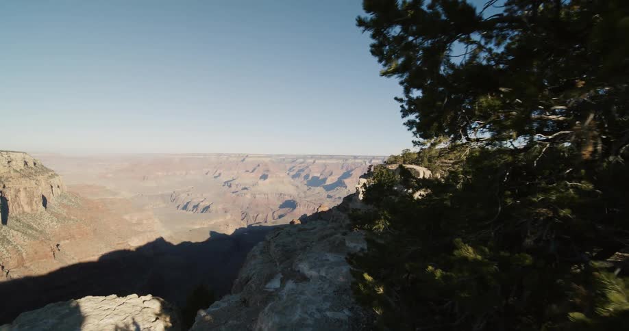 Aerial view of canyons and mountains are displayed
