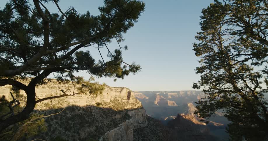 Shadow partially covers misty canyon and valley