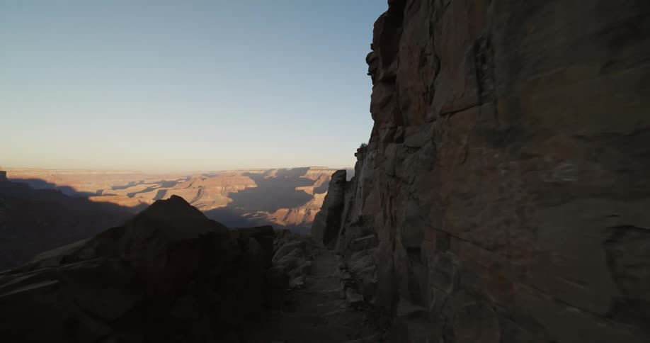 Cliff and other portions of badlands sit in shadow