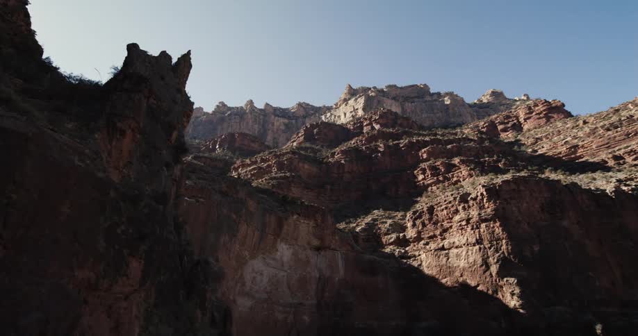 A large butte in the countryside during the day