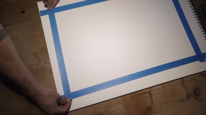 A person puts tape on his pad