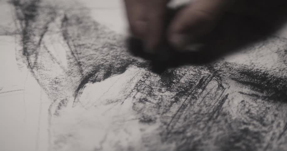 A person sketching on a piece of paper