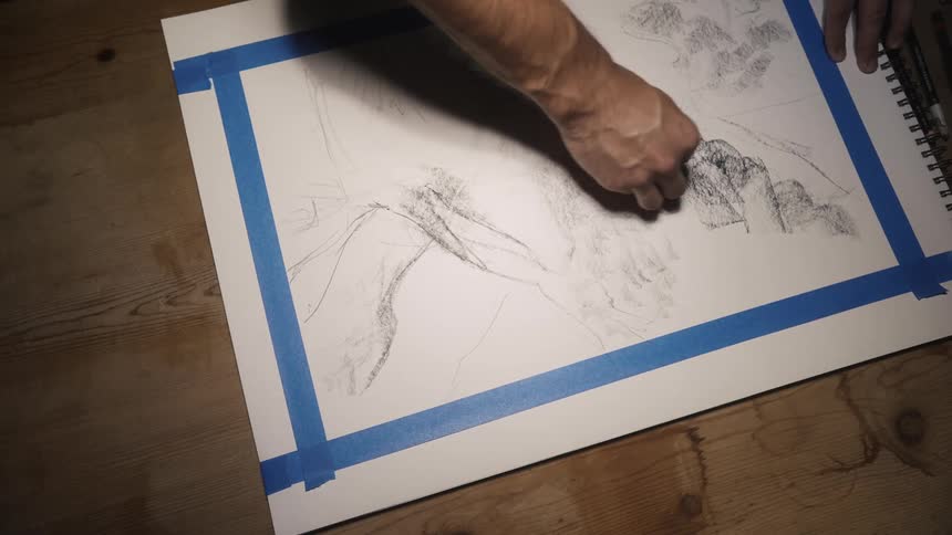 A person is drawing on the canvas