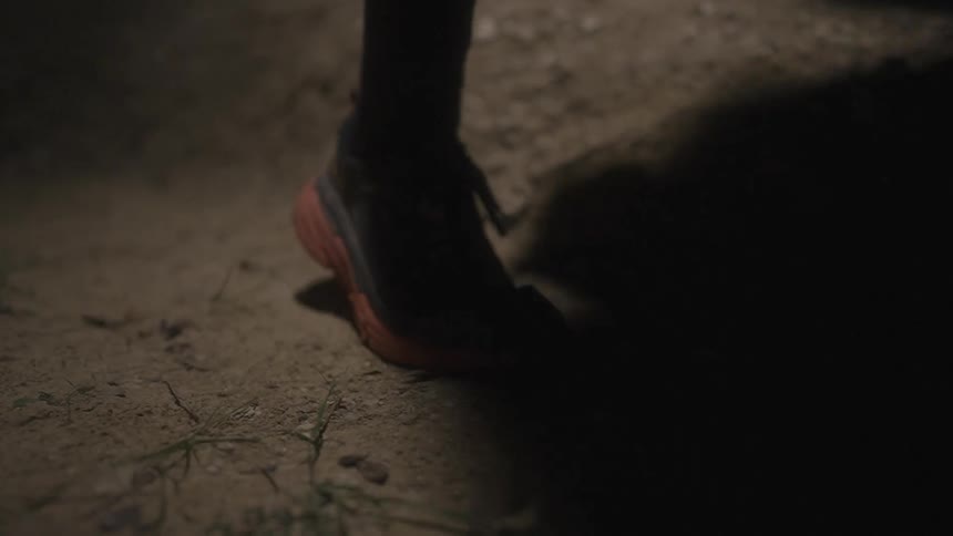 Slow motion footage of a persons foot as they run