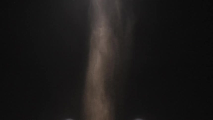 The dust falls in the dark area