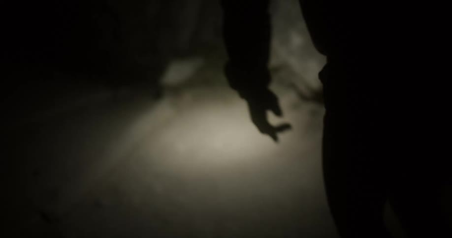 A man travels through the dark tunnel