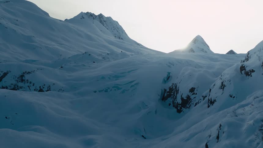 Snow is covering a mountain in the season of winter