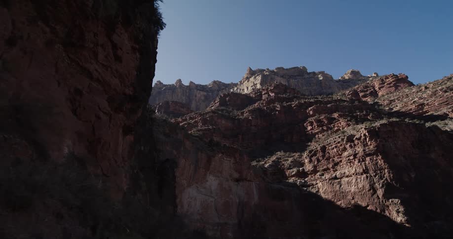 The tall mountain is under the clear sky