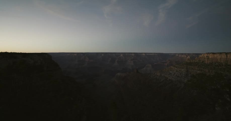 An immense canyon under a clear daytime sky