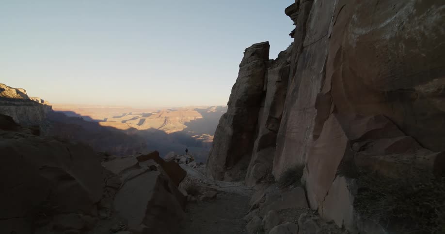 Sun reflects off the rock of a mountain range