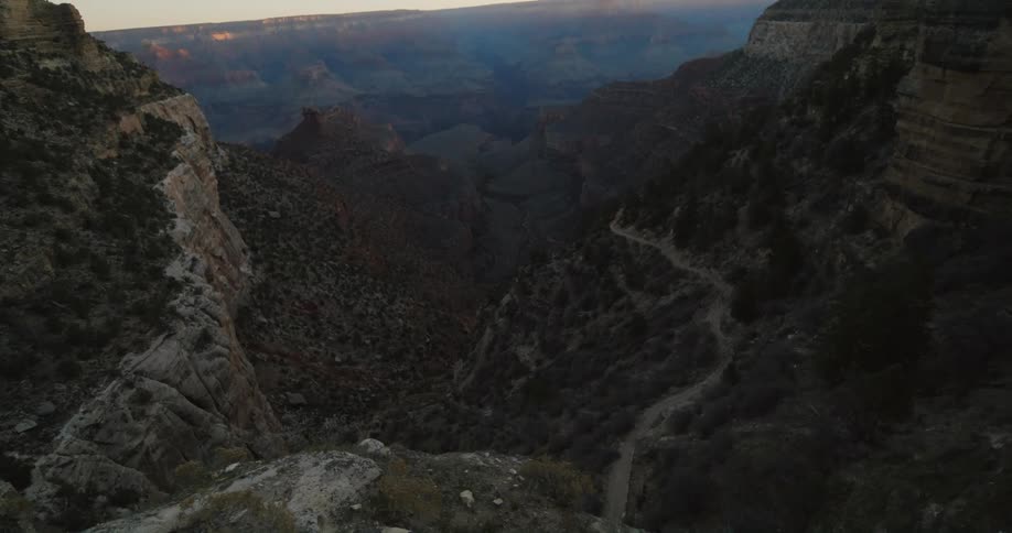 The edge of an immense canyon during the day