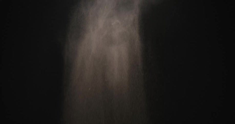 Dust falls in the dark room